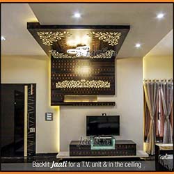 Living area enhanced with a backlit Jaali for a T.V. unit & in the ceiling cut from veneer copy.jpg